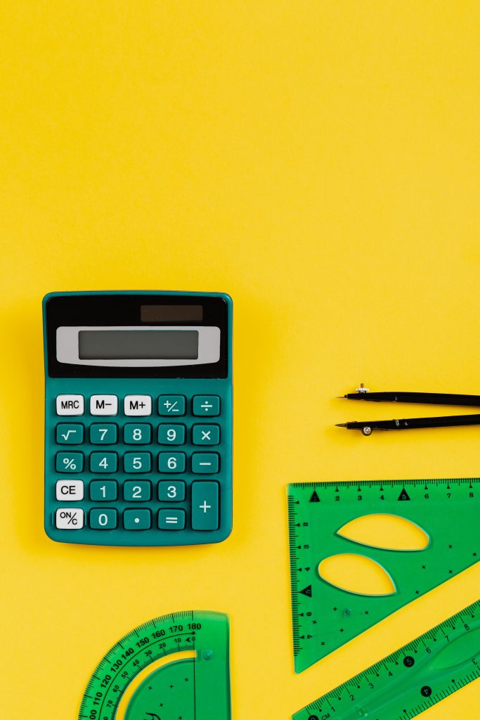 Green Calculator On Yellow Background
