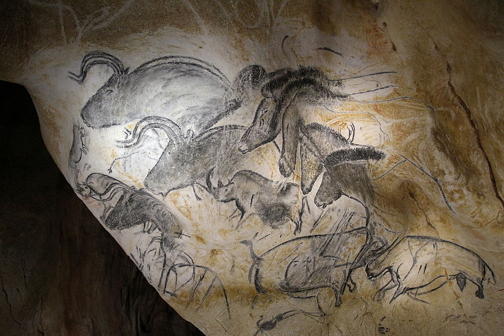 rock painting of early horses and bulls.