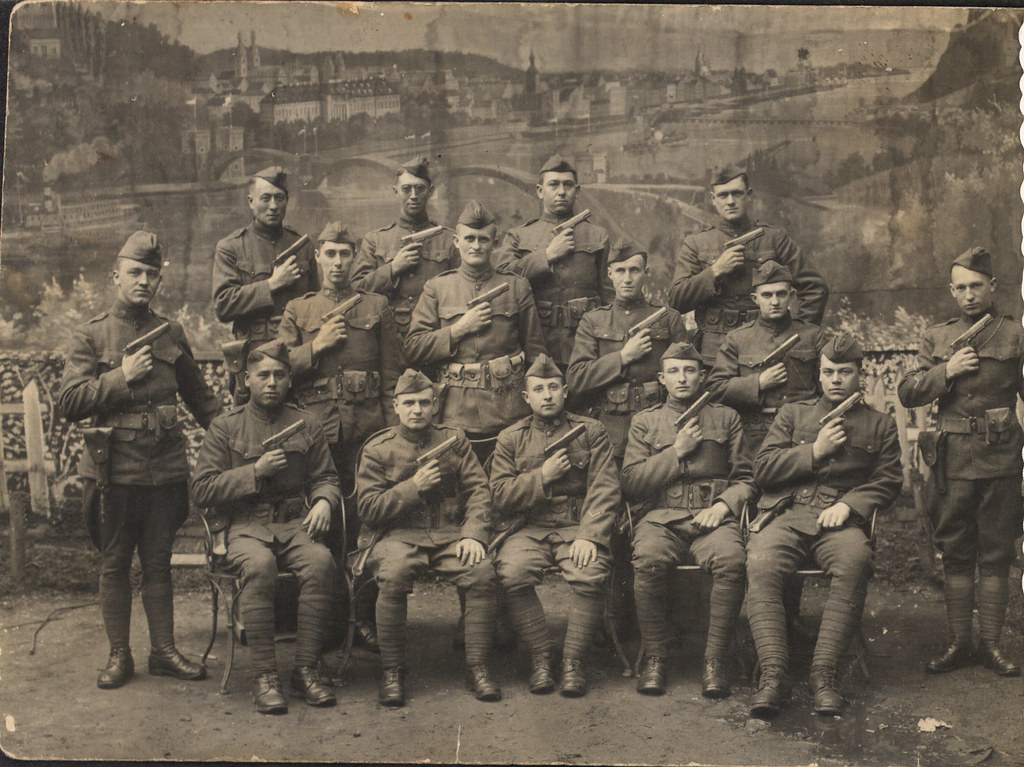 sepia tone photo of soldiers posing