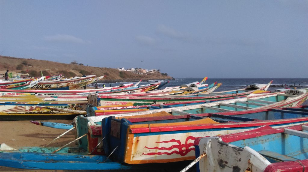 Colorful pirogues on the beach in Dakar.
