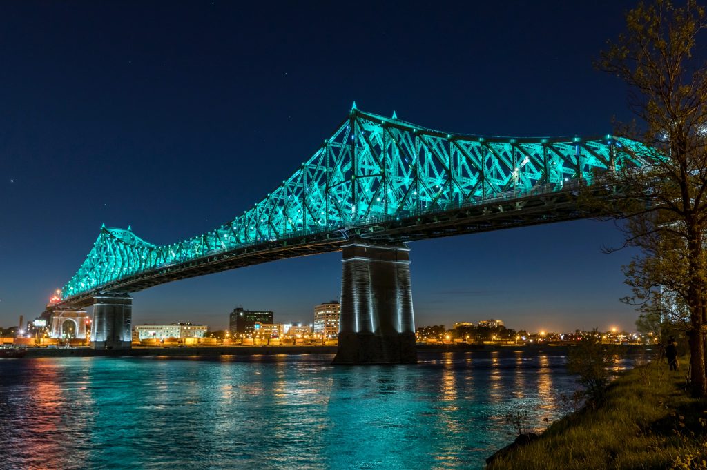 Jacques Cartier bridge in Montreal lights up the night sky.