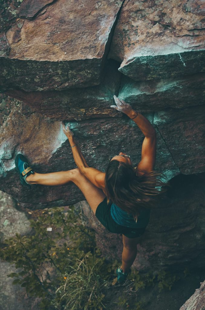 Woman climbing a mountain