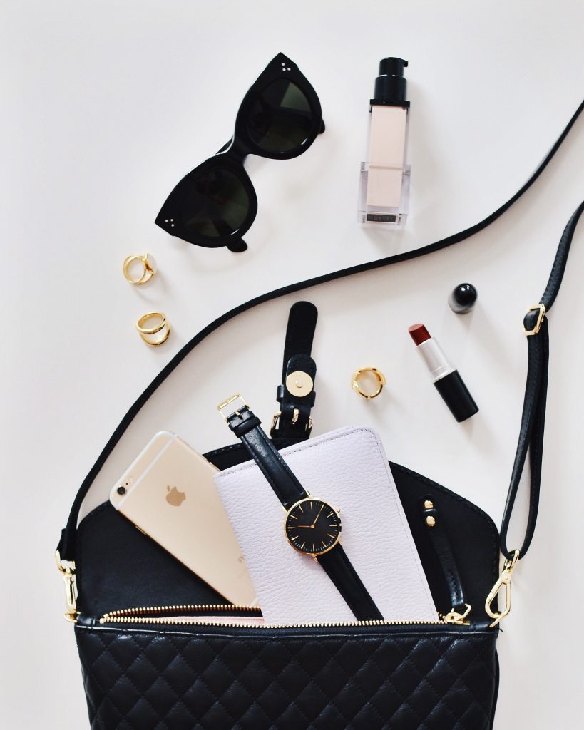 What's in my bag with all the items aligned next to a purse.