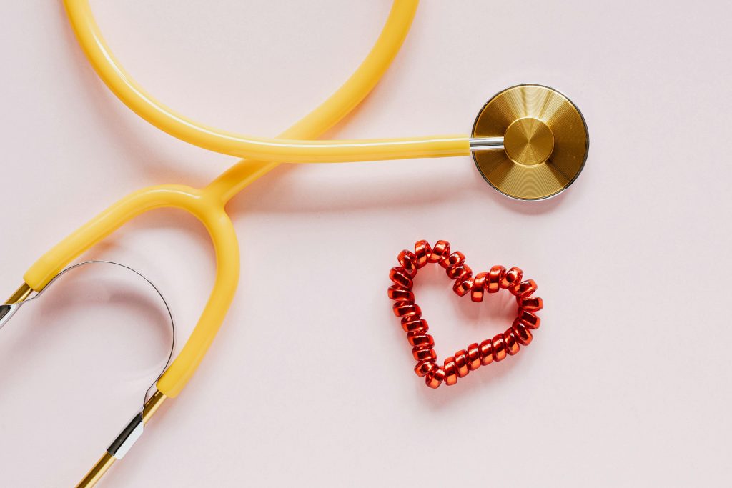 Image of a yellow stethoscope and a red heart