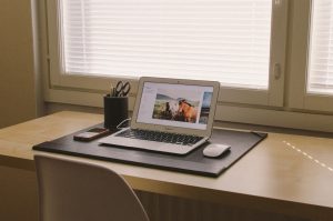 Open laptop sitting on a clean desk