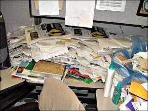 Many scattered papers covering a desk
