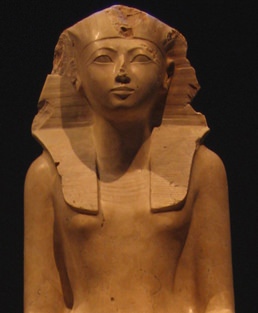 Stone head and top half of an Egyptian man with headdress
