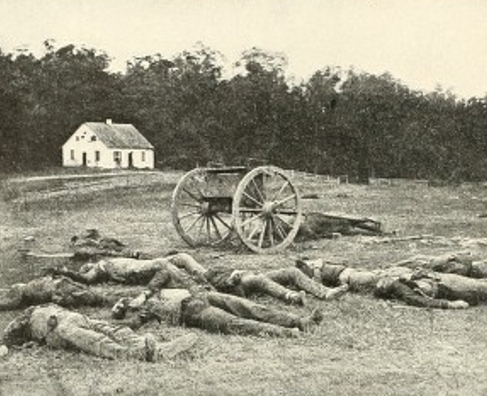 Small church in background of soldiers lying dead around an old plow in a field