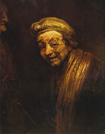 Man in gold color wearing a hat and smiling
