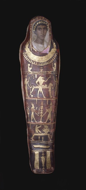 Mummy-shaped long coffin in dark read with a head of a young man painted on top and golden Egyptian art below