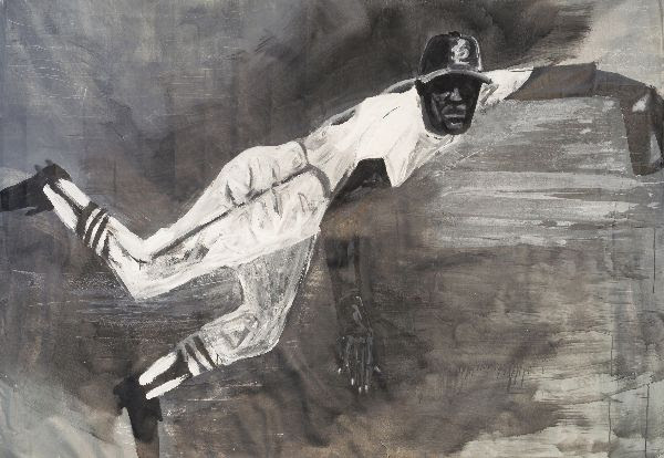 Baseball player with dark skin reaching for a ball on a gray background