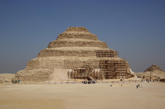 Dirt covered pyramid in a dessert under a blue sky