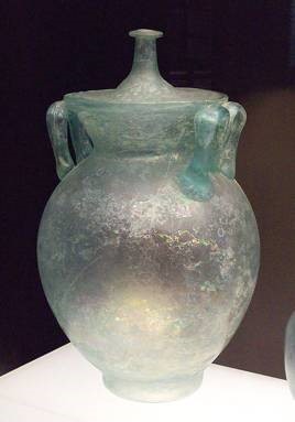 Fat vase made of greenish glass with lid and handles