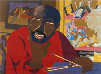Dark man with a mustache and red shirt in an artist studio with paintbrushes
