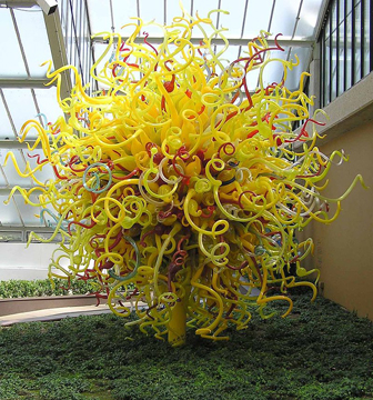 Tree shape made of yellow, white, and red swirling plastic