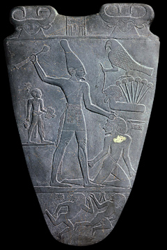 Stone shield with carvings of men and birds from Ancient Egypt
