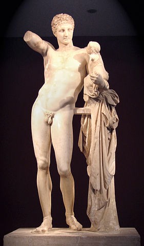Statue of a naked man holding up half an arm with a baby in other arm