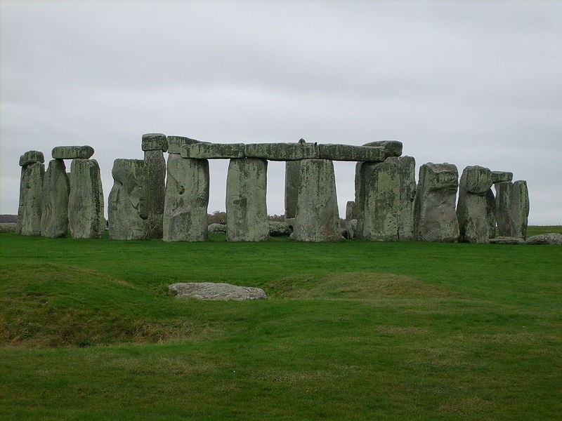 Row of rectangular stones on a green field