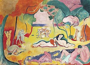 Several naked women and men in a yellow field with pink trees