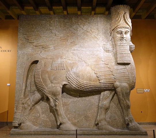 Large stone carving of a horse with armor and a Pharaoh's head