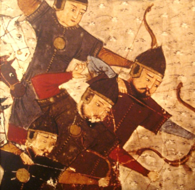 Four men with pointed helmets pointing bows and arrows downward