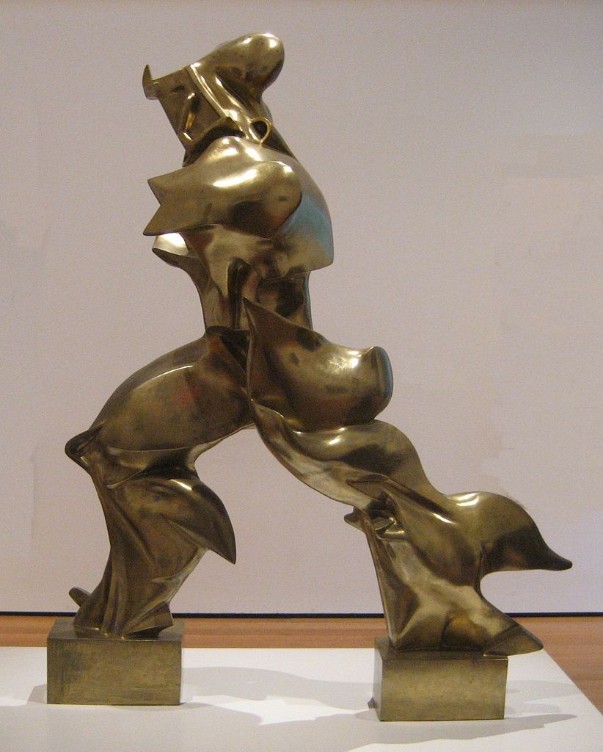Gold figure of human form made of curves and shapes