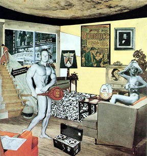 A gray man and somean in a living room near a record player and television