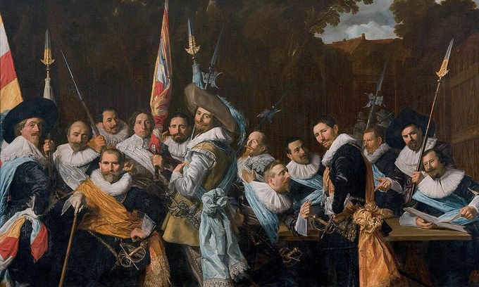 Crowd of men holding spears and flags, many wearing large hats