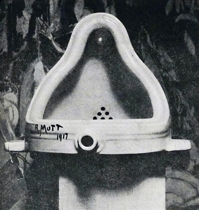 Gray and white urinal bowl labeled R. Mutt 1917