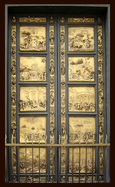 Two golden doors depicting scenes of nature and city in two columns