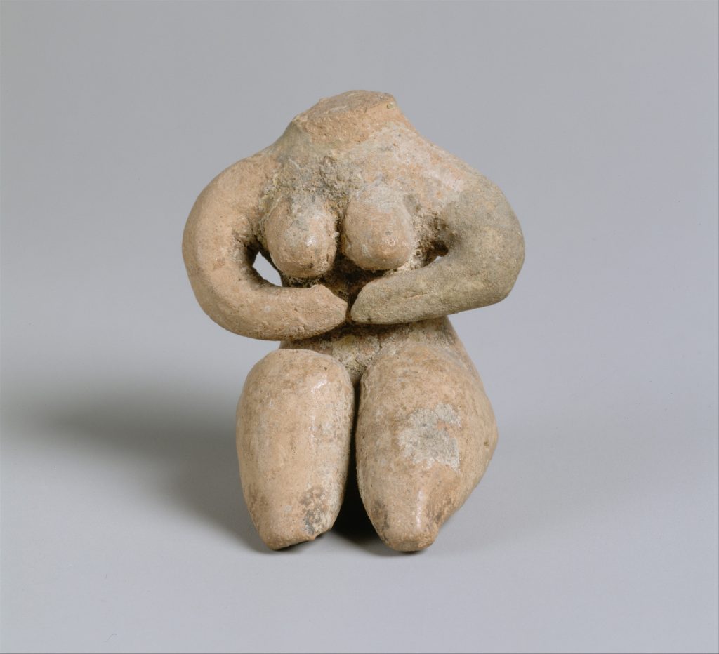 Figure of a seated woman with no head and arms connected under her breasts