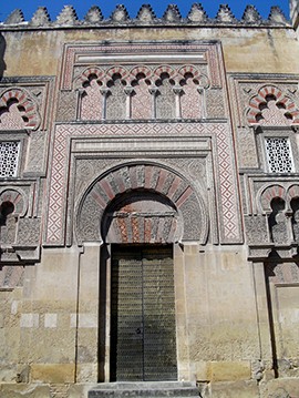 Door under rounded artwork on a wall