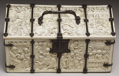 Stone box carved with human and household figures with black handle and clasp