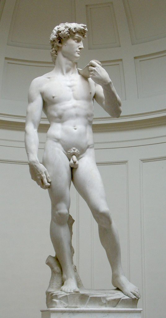 Stone naked man looking to the side and holding an item to his shoulder