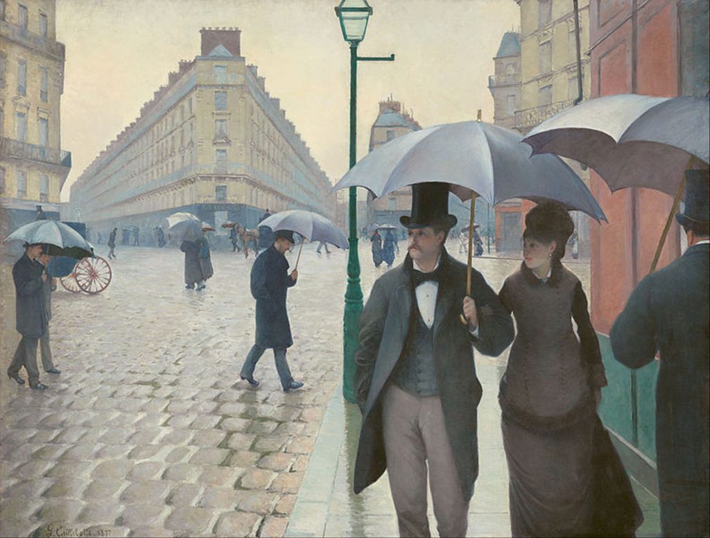 Man and woman under umbrella walking through a rainy city