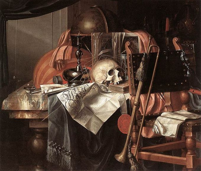 A desk and chair covered in a skull, trombone, papers, clothes, and other miscellaneous