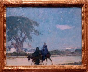 Framed painting of two robed people riding donkeys through a desert at night