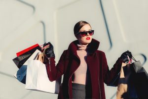 Woman holding many shopping bags