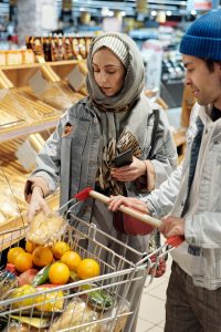 Two people grocery shopping