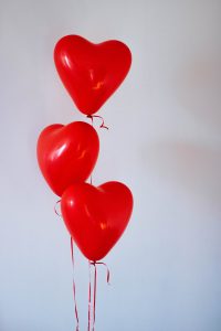 Three heart-shaped balloons