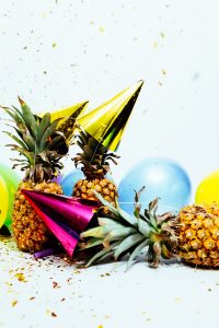 Party hats, pineapples, and balloons