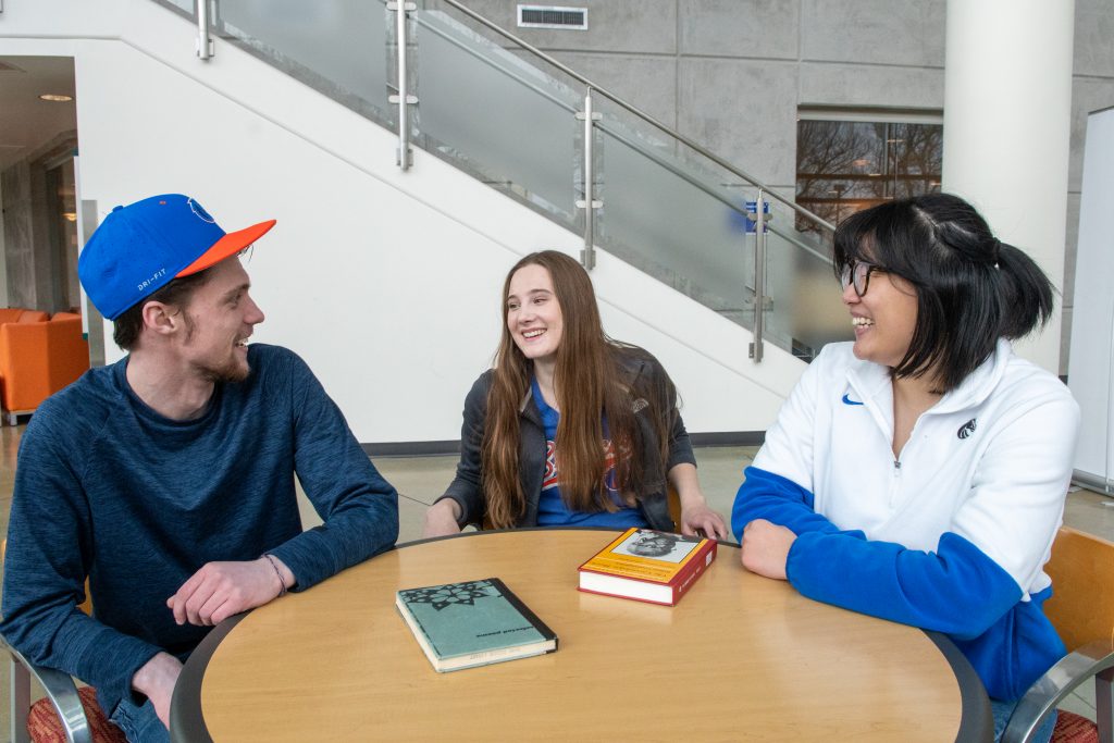 Three pathways project team members chat with one another