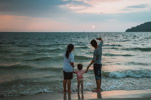 Family Standing on the Beach