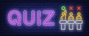 Photo of a neon QUIZ sign with three neon stick figures resembling Jeopardy.