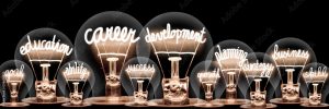 Photo of neon words in lightbulbs- education, career, development and others.