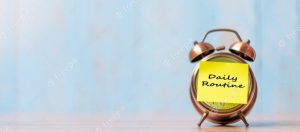 Picture of an alarm clock with a yellow sticky saying, "Daily Routine"