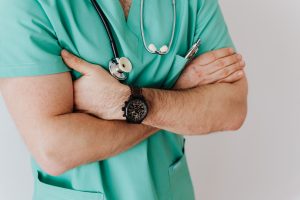 PHoto of a doctor with arms folded