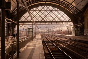 Photo of train tracks leading into a train station.